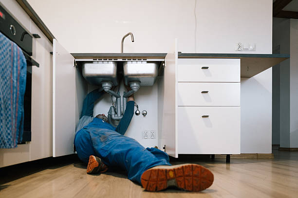 Professional Emergency Plumber technician working in Ortonville, MI